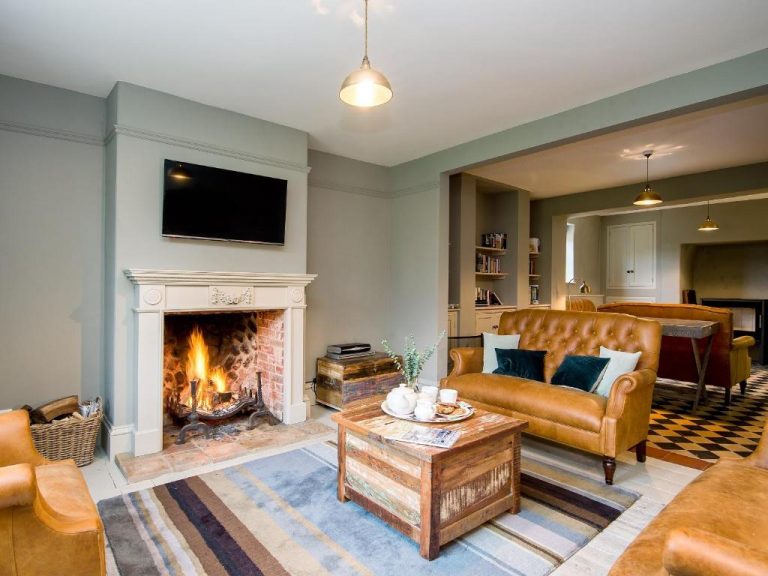 Open Fireplace with Fire in a Luxury Traditional Norfolk Holiday Let