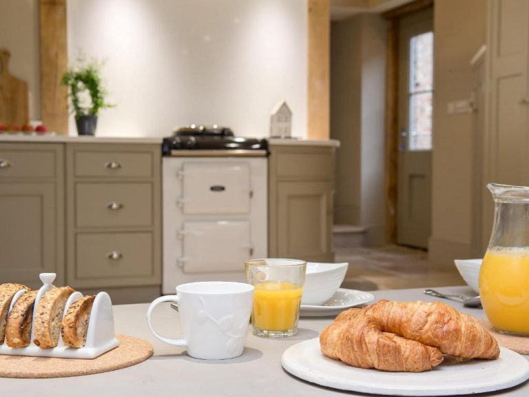Breakfast Bar with pastries on communal seating area on holiday in Norfolk