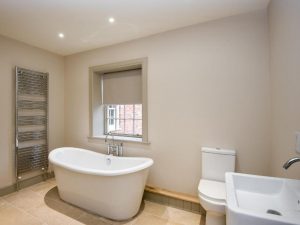 Slipper Bath in a Large Bathroom in Multiple Family Holiday Home Wedding Accommodation