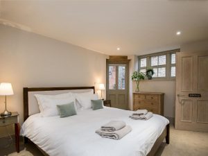 Double bedroom with courtyard access in Norfolk Farmhouse Holiday Home