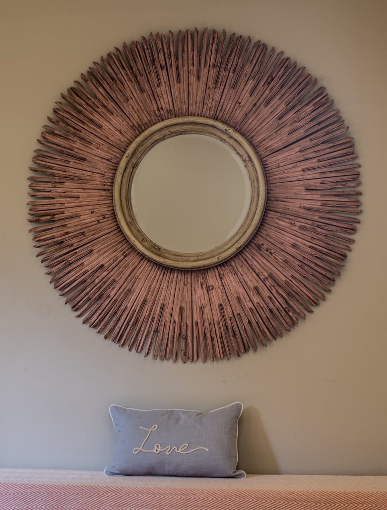 Sunburst mirror on the wall of a large luxury Norfolk holiday home