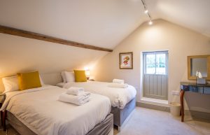 Twin Bedroom with Oak Beams in a traditional Norfolk Farmhouse for Holiday Rental