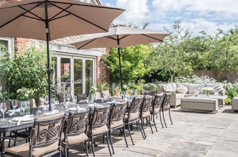 Cushioned outdoor holiday dining seating in Norfolk for up to 4 families
