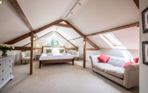 Large Bedroom with Oak Beams and Skylights in a Traditional Norfolk Holiday Let
