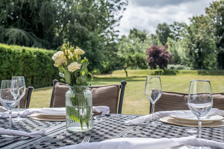 Dining Alfresco in Tree lined garden in a boutique Norfolk Holiday Home