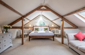 Spacious Kingsize bedroom with sofa in converted Norfolk Barn Holiday Home